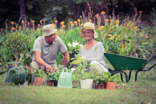 Landscape worker planning safe site work with tools and protective gear